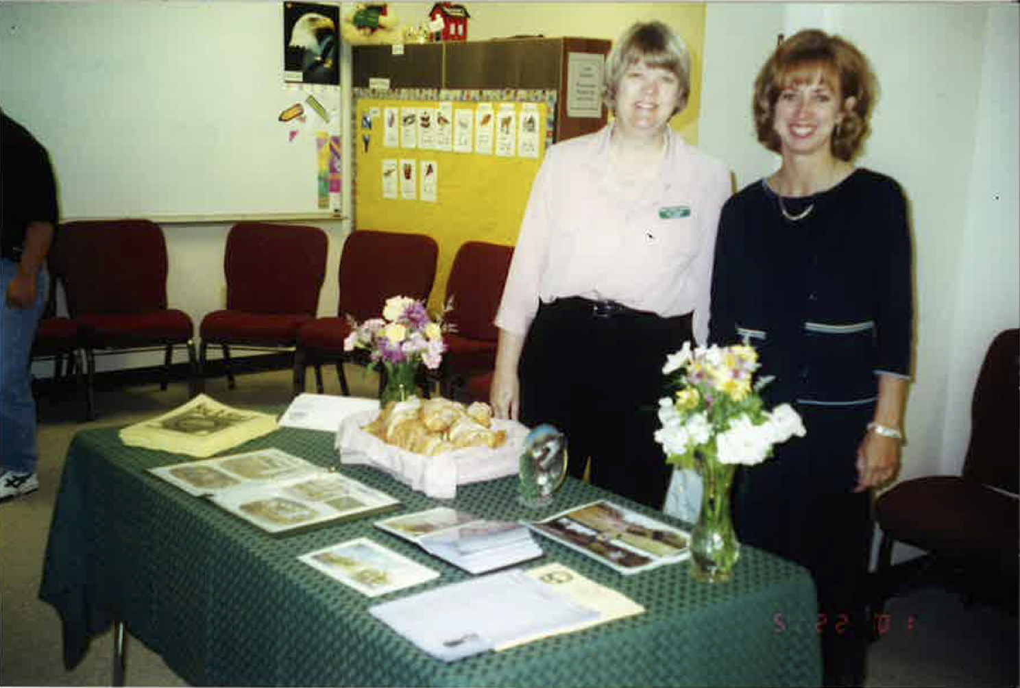 Lin Mayberry and Robin Buffington, two long-time teachers and friends at Legacy Christian Academy standing behind a table
