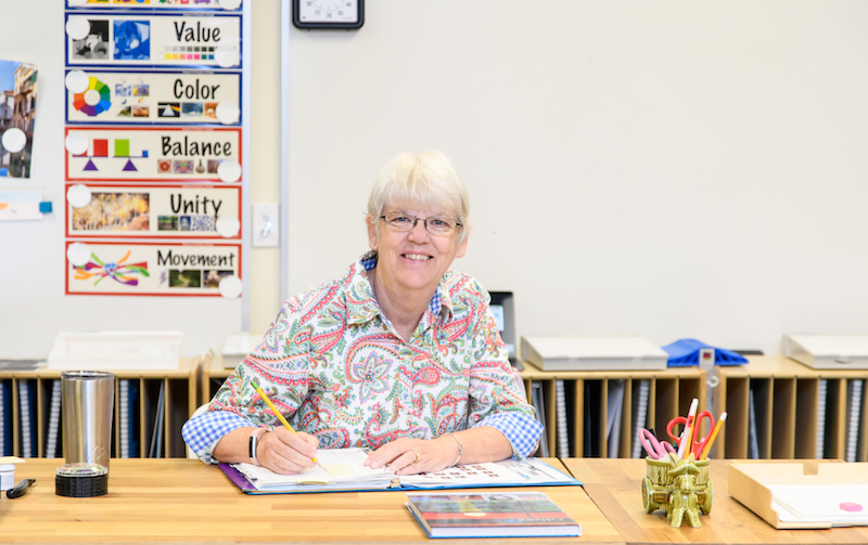 Lin Mayberry, Legacy Christian Academy middle school art teacher, working at her desk