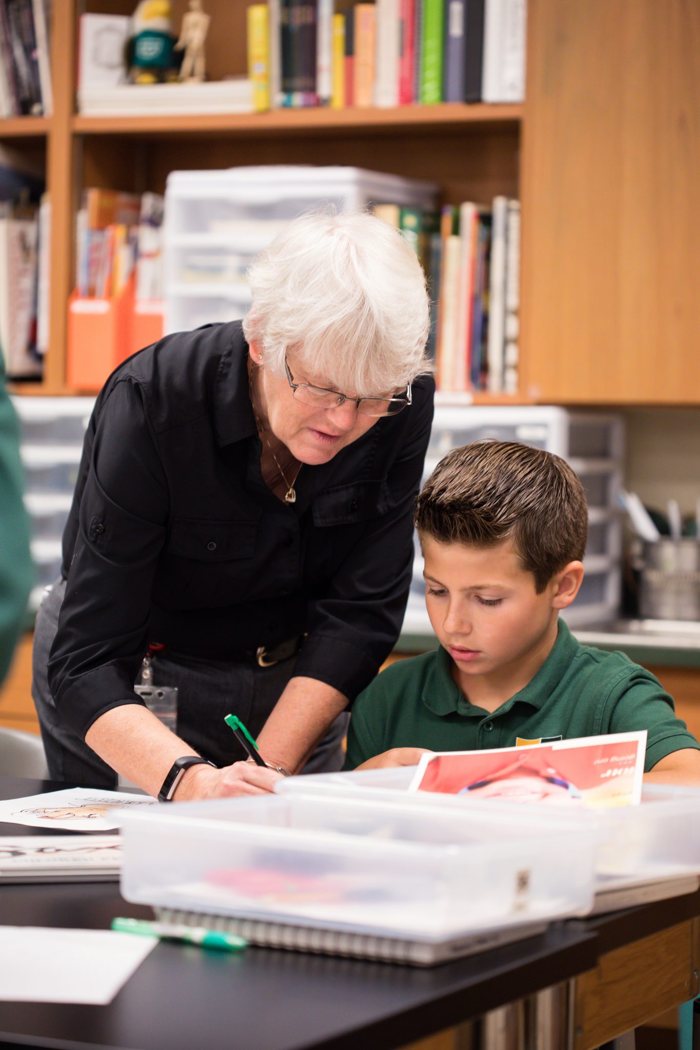 Lin Mayberry, middle school art teacher, working with a male student