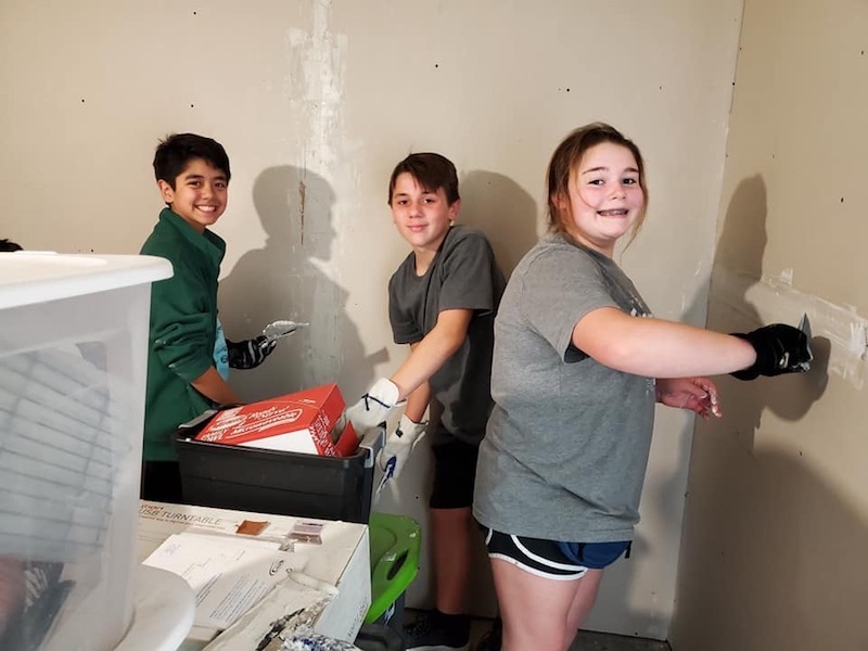 Legacy Christian Academy Middle School students working on a house project while in Houston