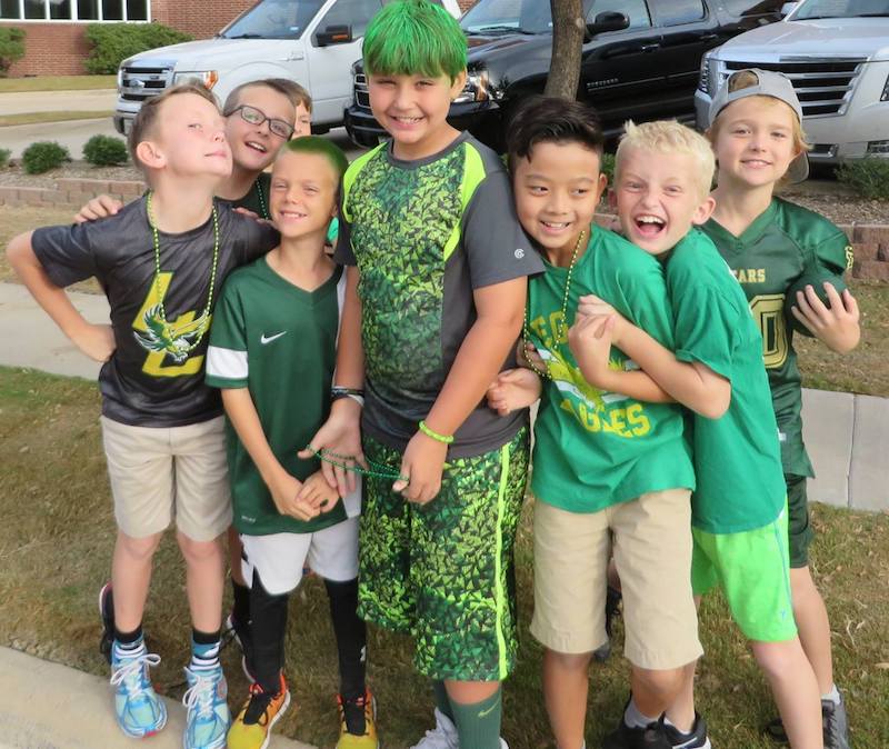 Grant Edwards with his hair dyed green together with some of his classmates