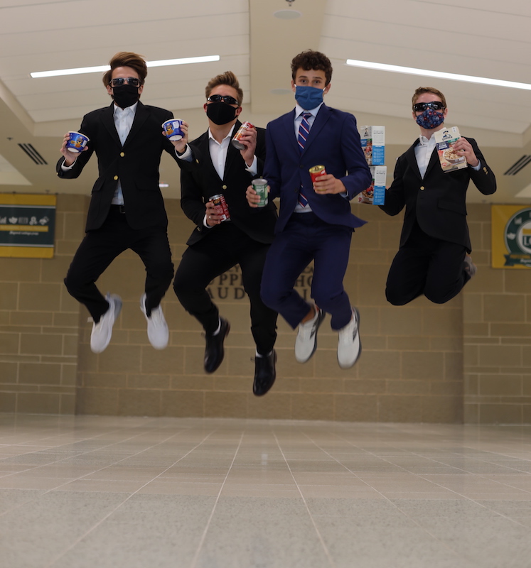 NHS Officers jump for joy after collecting food for Frisco Fastpacs