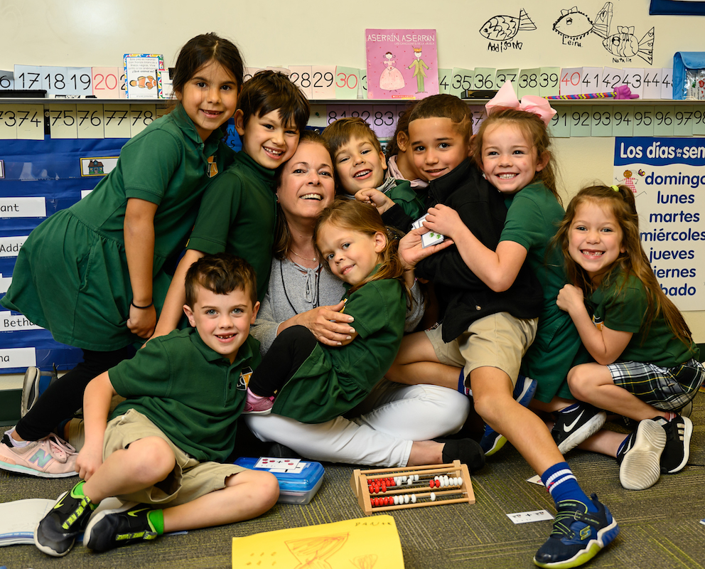 Legacy Christian Academy kindergarten Spanish Immersion students sharing a group hug