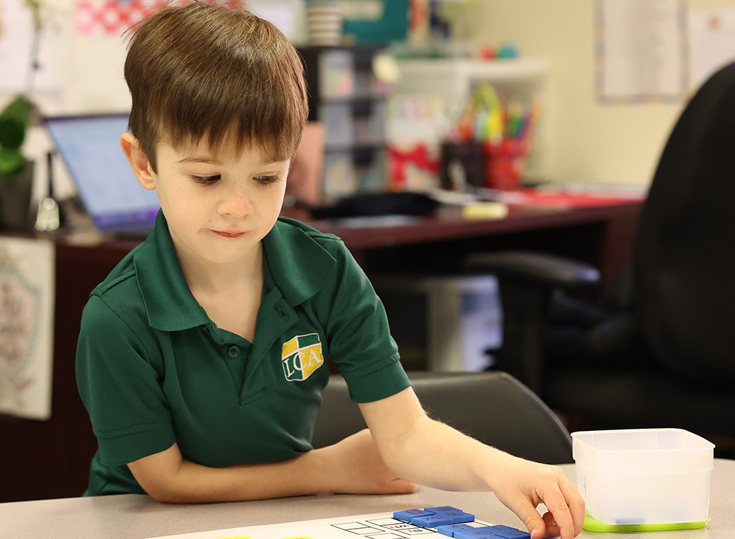 Kindergarten students engaged in classroom learning at Legacy Christian Academy